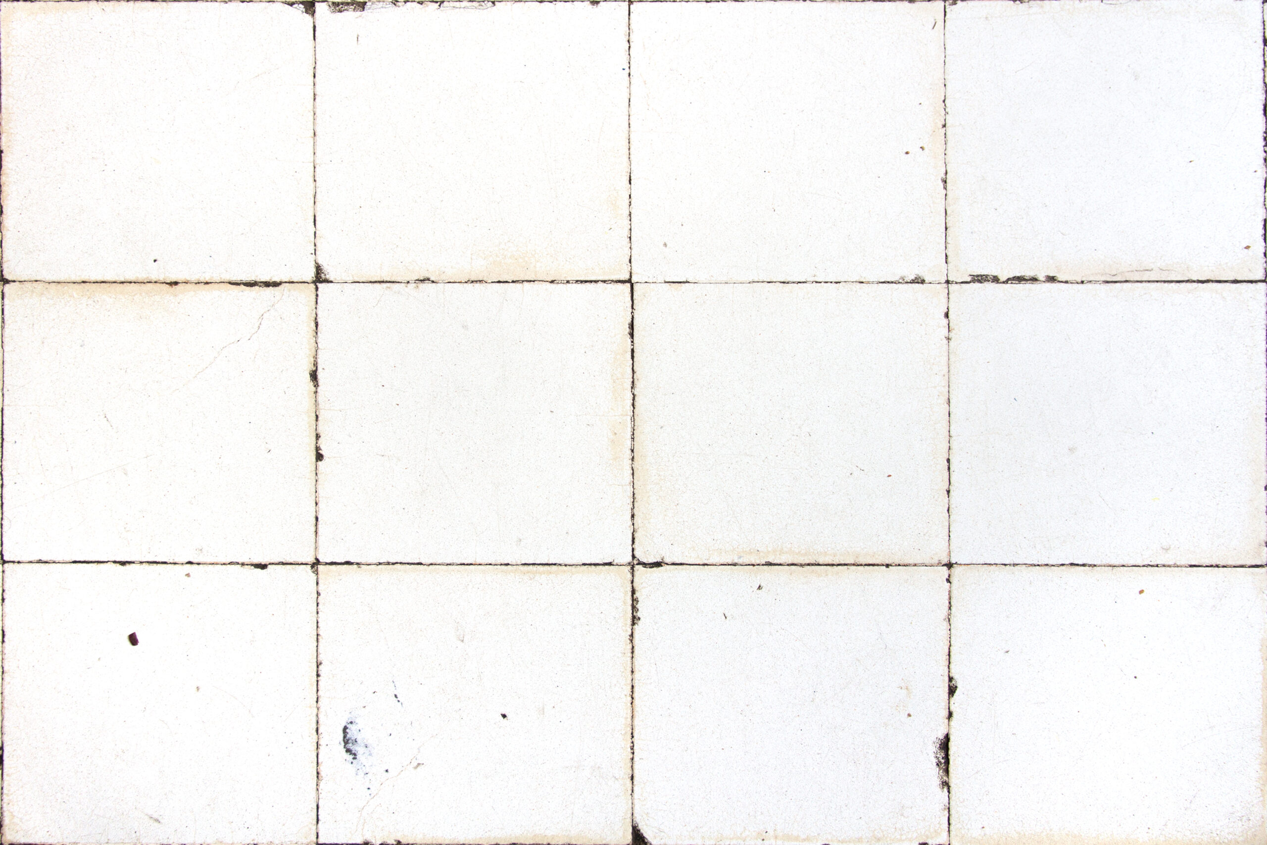 damaged and discoloured bathrom tiles, square white tiles